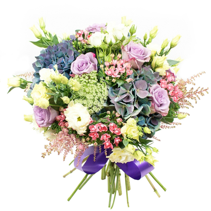 This luxurious floral bouquet, crafted by the skilled hands of Stanmore's local florists, is displayed against a clean white background and radiates a harmony of cool colours and velvety textures. The centre is abloom with deep indigo and teal hydrangea, their soft, rounded clusters recalling tranquil summer evenings in Bentley Priory's gardens. Poised within these blooms are elegant roses in both gentle lilac and creamy white, their classic forms framed by ruffled white ranunculus and pale, chartreuse-tinted eustoma buds. Dotted between, vibrant fuchsia-pink blossoms and blush-pink astilbe extend a playful brightness and soft, airy edge, akin to the lighthearted mood of Stanmore's local fairs. Wispy, intricate greens-delicately textured and almost translucent-intertwine gracefully, adding depth and an organic character. The finishing flourish comes with a lustrous wide purple satin ribbon, wrapping the tidy stems in opulent unity and drawing out the cool undertones of the bouquet. This arrangement exudes refined sophistication, fresh beauty, and a contemporary touch-perfect as an impressive gift or distinctive centerpiece for Stanmore occasions, always delivered with freshness and pride by those who know the area best.