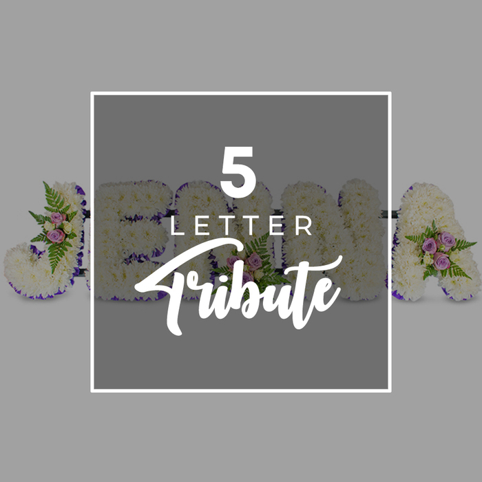 This image captures a refined five-letter funeral flower tribute, carefully styled on a soft light grey backdrop so every petal and ribbon edge is clearly visible. Each of the large letters stands side by side, the face completely covered with tightly packed white chrysanthemums. The blooms overlap gently, giving the surface a velvety, cushion-like appearance that feels comforting and pure, echoing the quiet atmosphere of services held around Stanmore Country Park and local places of worship. Around the perimeter of each letter, a deep purple satin ribbon is expertly fixed, following each curve and corner with precision. The rich purple tone lends structure and solemnity, creating a clear outline that helps the letters stand out in a church or crematorium setting. Dotted across the tribute are small, beautifully balanced floral accents: clusters of pale pink and mauve spray roses, their petals soft and slightly ruffled, resting among delicate green fern fronds and sprigs of fresh foliage. These gentle touches of colour and greenery add depth, dimension, and a whisper of fragrance, suggesting tenderness, remembrance, and a loving farewell. The arrangement shows a J at the far left, followed by glimpses of O, H, and N, with an A to the far right, indicating how the display can spell a five-letter name or significant word. Over the central portion of the letters is a translucent, slightly darker grey square bordered in white, bearing the inscription 5 LETTER in bold, white uppercase letters above Tribute in elegant script. Crafted in the style often requested from Flower Delivery Stanmore, this design clearly represents a personalised funeral flower tribute for memorial and farewell ceremonies throughout Stanmore.