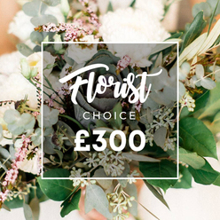 An intimate Stanmore scene presents this Florist Choice bouquet in a soft, luminous glow. Creamy whites and pale blush tones form a serene backdrop, carried by generous, cloud-like blossoms-garden roses, peonies, or perhaps camellia-style blooms-interwoven with white lisianthus and campanula for delicate texture. Lush eucalyptus leaves provide cool, silvery contrast, while olive branches add slender lines and a touch of Mediterranean charm; tiny clusters of pale green buds or berries nod to hypericum or young eucalyptus seed pods. In the center sits a striking, darker green, almost purplish ornamental kale or a small succulent head, injecting contemporary edge. Tiny sprigs of light pink or mauve-waxflower or heather-provide warmth without overpowering the purity of the whites. The bouquet rests in a natural, unstructured presentation that invites touch and scent, as if you could breathe in the clean perfume of the petals and the crisp greenery. A crisp white rectangular frame overlays the arrangement with 'Florist Choice'-'Florist' scripted in a flowing white script and 'CHOICE' in a bold sans-serif-followed by the price '?300' in bold white type. Set against a soft, neutral background, the image speaks of refined craftsmanship and thoughtful curation. A perfect choice for weddings, anniversaries, or heartfelt gifts, this piece is available for same-day delivery across Stanmore, Canons Park, and the surrounding streets, reflecting Flower Delivery Stanmore's local expertise.