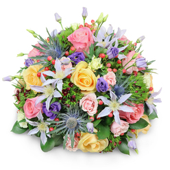 A beautifully rounded bouquet of premium flowers is shown against a pure white background, the simplicity of the scene drawing attention to the careful craftsmanship and rich mix of colours, as if the arrangement has been freshly tied in a Stanmore studio. At its heart, generous garden roses in gentle blush pink, sunshine yellow, and soft peach tones create a romantic, welcoming core. Some blooms are fully open, their layered petals forming intricate rosettes, while others remain partially closed, hinting at new beginnings and quiet anticipation. Peeking between the roses, star-shaped clematis flowers in white and pale lavender extend their elegant, slender petals around bright yellow centres, lending a floaty, garden-inspired charm that evokes walks through leafy streets near Stanmore Common. Tall stems of blue eryngium, or sea holly, push through the softer florals, their spiky, metallic blue-grey heads providing bold texture and a contemporary, slightly untamed accent. Nestled throughout, purple lisianthus blooms appear in different stages of opening, from firm buds to relaxed, gently ruffled cups, adding areas of deeper colour and soft shadow. Clusters of bright red hypericum berries dot the bouquet like tiny, polished beads, making playful, cheerful interruptions in the pastel harmony. A varied selection of greenery supports and frames the flowers: broad, glossy leaves create a sturdy foundation, while feathery sprigs and occasional hints of dark, wine-toned foliage add depth and interest. Soft, diffuse lighting ensures each petal, leaf, and berry is easily distinguishable, with only a faint shadow grounding the arrangement. The bouquet conveys a mood of thoughtful celebration and heartfelt sentiment, perfect for birthdays, thank-you gifts, or sympathy tributes delivered to homes and businesses around Stanmore station, Belmont Circle, and the surrounding HA7 area.