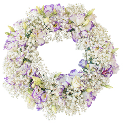 A beautifully constructed funeral wreath is pictured against a clean white backdrop, its perfect circular form evoking the idea of unending love and remembrance. The base is built entirely from profusions of white Baby's Breath, whose countless miniature blossoms give the wreath a soft, cloud-like appearance, as if it were ringed in gentle mist. Emerging from this delicate haze at regular intervals are Lisianthus blooms in cool, understated tones. Each Lisianthus has ruffled, multi-layered petals that start in creamy white and are subtly edged with hues of lavender, lilac, and deeper purple-violet, creating a gentle but noticeable contrast. Some of the flowers are wide open, revealing complex folds and more shadowed centres, while smaller buds and partially open blooms add variation and a sense of quiet growth. The flowers are arranged so evenly that there are no gaps or irregularities in the ring, and the open centre is clearly visible, echoing the wreath's outer edge. There is no added greenery or decorative ribbon, so the focus stays entirely on the interplay of white and purple, light and texture. This tranquil design feels especially suited to a memorial gathering or funeral service in Stanmore, whether in a local church, synagogue, or crematorium, where families might wish to express their condolences with something understated yet deeply thoughtful. Created with the steady hand of an experienced florist from Flower Delivery Stanmore, the wreath communicates comfort, purity, and a quiet, respectful farewell.