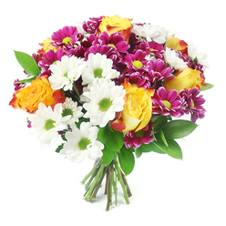 Against a simple white backdrop, a vibrant, full-bodied bouquet is captured in rich detail, as if freshly arranged in a Stanmore flower studio and placed gently on a spotless counter. The flowers are clustered into a rounded, almost spherical shape, with the eye immediately drawn to the striking bi-colour roses, whose petals move from bright golden yellow at the centre to glowing orange and hints of reddish-orange at the tips, radiating warmth like sunset light over Stanmore Country Park. Scattered abundantly throughout are clear white daisy-like chrysanthemums, each one perfectly ringed with petals around a vivid lime-green centre that brings a clean, modern freshness to the design. Between them sit clusters of deeply coloured magenta and fuchsia chrysanthemums, their many layered petals forming cushioned, button-like heads, each accented with a tiny yellow-green heart, adding depth and an almost velvety texture. Threads of dark, polished green foliage weave through the flowers, echoing the leafy streets around Marsh Lane and Dennis Lane, and giving the bouquet a natural, garden-fresh feeling. At the base, a tidy bundle of stems is visible, cut straight and gathered together, suggesting that this is a hand-tied arrangement prepared for easy placing in a vase at home. The lighting is bright yet soft, making every colour pop without harshness, and the overall impression is one of cheerful celebration and thoughtful care, suitable for marking an anniversary in Stanmore, welcoming a new neighbour, or sending a burst of colour to someone who needs a lift.