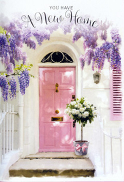 This image shows a charming entrance that could belong to a peaceful residential street in Stanmore, captured at that tender moment when a new house is on the cusp of becoming a home. At the centre is a delicately painted pink front door, its surface smooth and understated, the blush tone subtly luminous against crisp whitewashed walls. Light touches the door and walls in a way that feels gentle rather than stark, suggesting filtered sunshine on a calm afternoon, like those over the leafy roads leading toward Canons Park. Draped around the upper frame, lush wisteria spills down in generous cascades of lavender and pale violet, the pendant blooms forming soft vertical lines that frame the entry with natural elegance. The flowers appear full and slightly tumbling, as if they've been encouraged by years of patient tending. On the step below, a grey metal bucket sits with quiet assurance, chosen not for showiness but for its timeless simplicity. From it emerges a carefully crafted arrangement of white and creamy roses, their petals plush and layered, some blossoms tightly furled and others fully open, showcasing their intricate spiral centres. Interspersed among them, fresh green foliage adds depth and texture, its leaves slightly varied in tone like the mixed greens of Stanmore's gardens. A soft pink ribbon is tied around the bucket, its satin bow dropping gently, mirroring the curving lines of the wisteria. The overall composition radiates a sense of heartfelt welcome and discreet celebration, ideal for marking a move into a new home near Stanmore Golf Club or a freshly renovated flat off London Road. It feels like a florist's way of saying, without words, that this doorway is ready to receive laughter, family, and all the small, beautiful moments that define a life well lived.