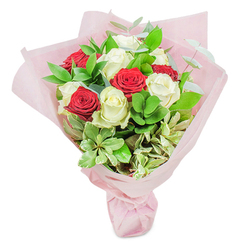 Brimming with local charm, this Stanmore-florist arrangement delivers sophistication and warmth in every detail. Pristine white roses, their petals softly unfurling, punctuate the bouquet with light and serenity, offset by the luxurious presence of velvety red roses-a visual dance of affection and renewal. The hand-selected greenery, drawn from inspirations around Brockley Hill and the leafy borders of Stanmore Park, frames the central blooms with depth and vibrancy. Wisps of eucalyptus and cream-variegated foliage create a subtle contrast, lending the piece a brightness that echoes gentle sunlight on quiet suburban paths. Swathed in blush-pink wrapping paper, the bouquet is cradled in a soft, luminous embrace, conjuring an atmosphere of tenderness and quiet hope. This arrangement is the perfect token for birthdays, milestones, or simply letting someone in Stanmore know they are cherished, uniting the intimacy of expert local floristry with the enduring language of roses.