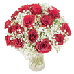 A classic, dome-shaped bouquet of roughly eighteen to twenty richly coloured deep red roses, each bloom unfurling velvety, fully opened petals that catch the light like small crimson cups. The roses are nestled in generous clouds of delicate white baby's breath (Gypsophila paniculata), whose tiny star-like blossoms spill between the roses and soften their intensity with a feather-light, misty contrast. Set in a clear glass vase on a pristine white surface, the long, verdant green stems are visible through the water, lending a fresh, architectural rhythm beneath the lush rounded head. The composition reads as both intimate and celebratory: the texture of smooth, cool glass, the velvet of petals under a faint sheen, and the whisper-soft tufts of gypsophila together create a tactile harmony. Sunlight seems to graze the arrangement, highlighting subtle variations in crimson and the translucent white of the baby's breath, while a gentle rose scent suggests warmth without overwhelming. This bouquet leans into timeless romance and quiet luxury-an ideal choice for anniversaries, Valentines, or any heartfelt moment when words alone fall short. As a florist who knows Stanmore's neighbourhoods, I picture this arrangement brightening a mantel in a home off Stanmore High Street or arriving with thoughtful care near Stanmore tube or Canons Park. The overall effect is poised, lovingly crafted, and immediate in its emotional intent: a concentrated expression of love and devotion wrapped in florist expertise and simple, elegant styling.