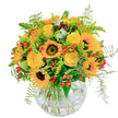 Emanating the golden light of a Stanmore afternoon, this dazzling bouquet channels the energy and warmth of the area's sunniest days. At its core, vivacious sunflowers with deep, velvety centres radiate happiness, their golden petals unfurling like rays stretching across Bernays Gardens. Among them, bright yellow roses spiral open, each bloom soft and lush, offering a quiet promise of joy and heartfelt celebration known to Stanmore's friendly community. Pops of vivid orange and lively clusters of crimson berries are interwoven with fresh greenery, delivering spark and contrast that delight the eye. Wispy ferns trail at the bouquet's edges, their feathery motion echoing breezy walks along Stanmore's leafy footpaths. Resting in a clear, rounded glass vase, the composition's stems form a natural, artful tangle, casting subtle reflections into the cool water below. The subtle fragrance-a blend of new leaves and sweet petals-evokes the freshness of garden flowers after rain. Intentionally crafted to uplift and delight, this arrangement is perfect for birthdays, thank-you gestures, or simply sharing a little Stanmore sunshine at home.