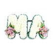 The image shows a dignified funeral flower tribute that forms the word MA in large, structured letters, offering a gentle, intimate way to say farewell to a much-loved mother or Mama. Each letter is carefully padded with white chrysanthemums, the small blooms closely packed together to create a dense, cloud-like finish that looks soft to the touch. Their petals form a finely textured surface, catching subtle highlights and shadows that give the tribute depth without overwhelming the eye. Encircling the outside edges of the M and A is a deep green ribbon, artfully arranged in small pleats so that it ripples slightly around the lettering, providing a refined frame and a striking contrast against the white flowers. A discreet dark green bar links the letters from behind, ensuring they stand together as one continuous design. At the lower left foot of the M and the lower right foot of the A, matching posies of pastel blooms lend a gentle splash of colour: lilac roses, soft blush-pink roses, and delicate pink spray roses, each petal soft and velvety. A single fern frond in each cluster adds a feathery, fresh green touch, echoing the trees and open spaces around Stanmore's parks. The tribute is presented on a simple white background, similar to how it might look when prepared in a Stanmore florist's workshop before delivery to a local funeral service or memorial gathering. Subtle yet deeply expressive, this MA floral lettering conveys love, gratitude, and remembrance in a way that feels both personal and beautifully composed.