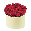 From the leafy streets of Stanmore, this luxurious rose presentation exudes romance and thoughtful gifting. The centerpiece is a lush gathering of deep red roses-approximately two dozen or more-each bloom velvety to the touch, with petals tightly furled as if in prime, newly opened moments. They are artfully arranged to fill a round, pale cream-colored box with a sleek, matte finish, a container whose shape recalls a classic hat-box destined for premium flower delivery. The bouquet forms a dense dome that rises just above the rim, a confident splash of colour that feels both intimate and grand.
Between the crimson heads, subtle bursts of dark green foliage peek through, adding natural contrast and a breath of freshness to the arrangement. The composition is captured from a slightly elevated, three-quarter angle, centering the elegant blossoms and their chic packaging against a clean white background that keeps the focus where it belongs. The light softens the petals, enhancing their velour-like texture and the box's smooth surface, creating a sense of luxury that invites touch and memory. This is a gift that speaks of love, devotion, and romance, perfectly suited to anniversaries, Valentine's gestures, or a refined surprise for a special someone. It represents a thoughtful expression you'd mail across Stanmore with same-day delivery options, bringing a couture bouquet to doors in Canons Park, Belmont, and surrounding NW London streets. Flower Delivery Stanmore is proud to present such a statement piece, crafted with care and designed to resonate with meaningful moments.