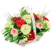The photograph shows a beautifully balanced funeral flower basket, created in a style that feels traditional yet softly comforting. The design rests in a pale wooden basket with an oval form and subtle, integrated feet that raise it slightly above the table, lending a neat, finished look. A smooth handle, painted in a light cream shade, arches across the top and frames a full, domed cluster of blooms that seems to overflow with quiet abundance. At the centre, several creamy white roses are fully open, their velvety petals layered in elegant spirals that suggest purity, remembrance, and peace. They are surrounded by deep red carnations, whose densely ruffled petals create pockets of rich, velvety colour, expressing enduring love and respect. Between these, softer pink and variegated carnations, some delicately trimmed or streaked with red, soften the palette and bring a tender, consoling feel. Smaller white flowers, probably freesias, appear on slender stems between the larger blooms, their open, bell-shaped heads lending a lighter, airy note. The flowers emerge from a base of lush, dark green foliage, with broad, glossy leaves reminiscent of ruscus or salal providing structure and depth. Wispy, feathery fronds, similar to asparagus fern, lift from the top and sides, breaking the outline and adding a natural, garden-like softness. Lit evenly against a pure white backdrop, the arrangement's reds, creams, pinks, and greens are all clearly defined. This style of basket, often chosen for services across Stanmore and the surrounding residential streets near Stanmore Station, would be suitable beside the casket, at a crematorium, or as a condolence tribute delivered to the family home, expressing sympathy with understated grace.