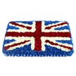 A large, rectangular floral arrangement in this image has been meticulously designed to recreate the Union Jack using fresh flowers, laid out against a simple white background that highlights its bold colours. The tribute is densely packed so that no foliage or base material shows through; instead, the eye meets an unbroken field of petals. Deep blue blossoms form the groundwork, their cool colour rich and uniform, calling to mind the calm, expansive skies often seen over Stanmore and its open spaces. Across this blue expanse, crisp white flowers shape the strong vertical and horizontal arms of St George's Cross, each line measured and exact. Diagonal streaks of velvety red carnations then overlay these, forming St Patrick's Cross, with narrow borders of white flowers tracing each side so that the structure of the Union Jack appears clean and well-defined. The florist has built the flowers up towards the centre, giving the tribute a gentle dome that creates subtle highlights and shadows when light brushes across the petals. Along the lower side, a pleated royal blue satin ribbon finishes the design, folding in soft, repetitive curves that mirror the blue of the blooms and add a formal, almost regimental note. The overall impression is dignified and patriotic, a piece that would be deeply appropriate for a funeral procession through Stanmore, a service for a veteran near Bentley Priory Museum, or any farewell where British heritage plays a meaningful part. Crafted with care and delivered fresh, this floral Union Jack offers both beauty and symbolic weight, honouring a loved one with grace and respect.