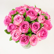 A generous, lush bouquet of roughly two dozen pink roses sits clustered in a simple clear glass vase, each bloom opened to reveal velvety layers of petals. The colour moves like a soft sunrise across the heads: deep fuchsia at the heart of several blooms that gently fades through candy pink to pale blush at the petal edges, producing a subtle, natural ombré that gives the arrangement depth and a lively, tactile quality. Dark, glossy green leaves are tucked between the roses, their cool tones creating a crisp contrast that emphasises the freshness and fullness of the bouquet. Photographed from a slightly elevated, overhead angle in soft, diffuse light, the composition reads round and abundant, every petal catching the gentle illumination so the textures look almost touchable. There is a faint, classic rose scent implied in the description-powdery and sweet-that suggests this is a bouquet meant to be held, inhaled, and cherished. A florist's hand is evident in the careful density of the stems and the balanced rhythm of colour across the head, making the arrangement feel celebratory yet refined. This design carries a mood of quiet romance and joyful affection, suitable as a token for anniversaries, Mother's Day, a birthday, or as a table centrepiece for an intimate gathering. Picture delivering such a bouquet on a crisp morning in Stanmore, its pink tones bright against a winter coat or summer dress, offering a moment of warmth and softness to the day.