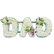 A classic DAD funeral tribute is captured in this image, its simplicity and elegance making it a fitting choice for a memorial service in Stanmore, whether in a quiet chapel or beside a graveside surrounded by trees. The three capital letters are engineered as sturdy, three-dimensional shapes and completely cloaked in tightly packed, pure white chrysanthemums or similar small button blooms. Their overlapping petals create a smooth, plush surface that appears almost like soft fabric from a distance, giving the tribute a gentle, comforting presence. Around the outside edge of each letter, an emerald green satin ribbon is neatly ruffled and pinned, following the contours precisely. This ribbon forms a vivid frame that defines the letters clearly and introduces a fresh, natural contrast, reminiscent of Stanmore's local parks and green spaces. Subtle hints of a dark supporting frame and horizontal bars can be glimpsed behind the arrangement, indicating that the piece is designed to stand upright during the funeral.   

Delicate adornments of additional flowers and foliage add a more personal touch. On the upper left side of the first D, a small cluster of white freesia and rich green leaves softens the outline, the freesias' slender stems and open blossoms bringing variation in shape and height. Two slender green stems extend from this accent and sweep diagonally across to the central A, linking the design and guiding the eye along the word. At the point where these stems meet the A, an asymmetrical focal spray features two deep purple calla lilies, their smooth, trumpet-shaped blooms cupping inward, nestled among more white freesia and glossy foliage. This deeper purple accent introduces a sense of quiet dignity and depth to the predominantly white and green tribute. The last D is finished with a smaller matching grouping of white flowers and greenery on its top right curve, balancing the composition. Together, these elements create a serene, respectful DAD arrangement that expresses love, sorrow, and meaningful remembrance for a father cherished by family and friends in Stanmore.
