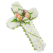 An elegant Christian floral cross, designed as a sympathy tribute, is photographed against a simple white background, evoking the calm of a Stanmore chapel just before a service begins. The cross is entirely sheathed in small white chrysanthemums, their rounded petals packed so tightly together that they form a smooth, plush-looking blanket of flowers. This sea of white suggests purity, peace, and a gentle farewell, much like the quiet stillness found in the early morning around Stanmore's tree-lined streets. Along the outer edge of the cross, a neat border of bright green foliage outlines the shape with crisp precision, highlighting the length of the vertical beam and the spread of the arms while providing a fresh contrast to the mass of white petals. At the very centre, a raised cluster of more prominent blooms introduces warmth and visual focus. Several roses in tones of soft peach, apricot, blush, and creamy ivory rise above the chrysanthemums, their layered petals unfurling in generous spirals. They are interwoven with feathery green ferns, slender blades of bright grass that arch gracefully, and tiny purple flowers that peep out in between, adding hints of colour and texture without disrupting the overall serenity of the piece. The lighting is bright yet gentle, reducing harsh shadows and allowing the structure and form of each bloom to be appreciated. This floral cross would be a fitting tribute for a funeral or remembrance service in the Stanmore area, whether placed near the altar, by the casket, or at the graveside, quietly expressing faith, love, and heartfelt condolences through flowers.