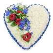 The photograph shows an elegant heart-shaped funeral tribute arranged on a plain white background, its details clear and evocative. The heart itself is entirely filled with fresh white chrysanthemums, their small, petal-packed heads placed so closely that they form a smooth, cushion-like layer, creating an impression of softness and purity. Tracing the outline of the heart is a royal blue satin ribbon, expertly pleated into gentle ruffles that frame the flowers and provide a striking contrast in both colour and texture, reminiscent of the polished touches often seen at services in Stanmore's churches and local crematorium. On the upper left side of the heart, an expressive floral spray adds depth and meaning: three deep red roses, fully open and velvety, nestle among dark green leaves, conveying devotion, respect, and farewell. Cascading from this cluster are vibrant electric blue dendrobium orchids, their distinctive star-shaped petals and rich blue tones standing out beautifully against the white chrysanthemums. Fine, curly green tendrils weave among the orchids, softening the lines and suggesting gentle movement. On the lower right portion of the heart, a single red rose is positioned with a small accent of greenery, subtly mirroring the main spray and creating visual harmony without overcrowding the design. The overall composition feels calm, dignified, and sincere, an arrangement that could be delivered by Flower Delivery Stanmore for a funeral service, chapel of rest, or family home in Stanmore, offering a gracious expression of sympathy and a lasting symbol of love and remembrance.