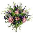 This hand-tied bouquet reads like a breezy Stanmore meadow captured on a crisp white canvas: soft antique-pink roses, some budded and some gently unfurling to reveal slightly darker pink petal edges, sit at the centre, their velvety faces lending classic romance. Two full mauve-rose carnations add ruffled volume and a tactile, almost watercolor softness, while tall spires of deep indigo-veronica punctuate the silhouette with bold vertical lines. Scattered throughout are clusters of dainty, pale lavender-blue aster-like blooms with tiny yellow centres that give a wild, airy lift; deeper purple lisianthus buds thread through like jewel-toned whispers. The base is a lush mix of rounded, silvery-green eucalyptus leaves and bright lime-green, bushy filler-reminiscent of Santini chrysanthemums-that create a fresh, dewy underlayer. Slender green leaves and emerging buds soften edges and keep the composition breathing. The stems are gathered and visible at the base, a clear sign of a hand-tied technique crafted to look effortless yet intentional. Lighting in the image is soft and neutral, allowing pastels and jewel tones to read true against the white background, and the overall scent profile suggests a quiet, green perfume with a hint of sweet floral. Ideal for birthdays, thank-you gestures, or simply to brighten a kitchen window, this arrangement has the uncontrived charm of flowers picked in late spring and arranged with a florist's eye for balance, texture, and natural movement - a small, joyful statement that feels both elegant and intimately local to Stanmore.